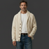 Off-White Shawl Collar Cardigan – One Hand in Pocket, Dark Charcoal Background